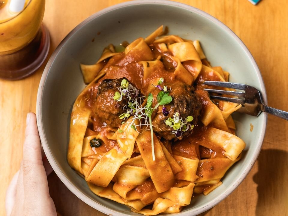 Pappardelle with meatballs in a bowl